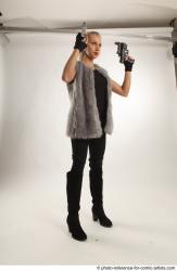 NIKOL STANDING POSE WITH TWO GUNS